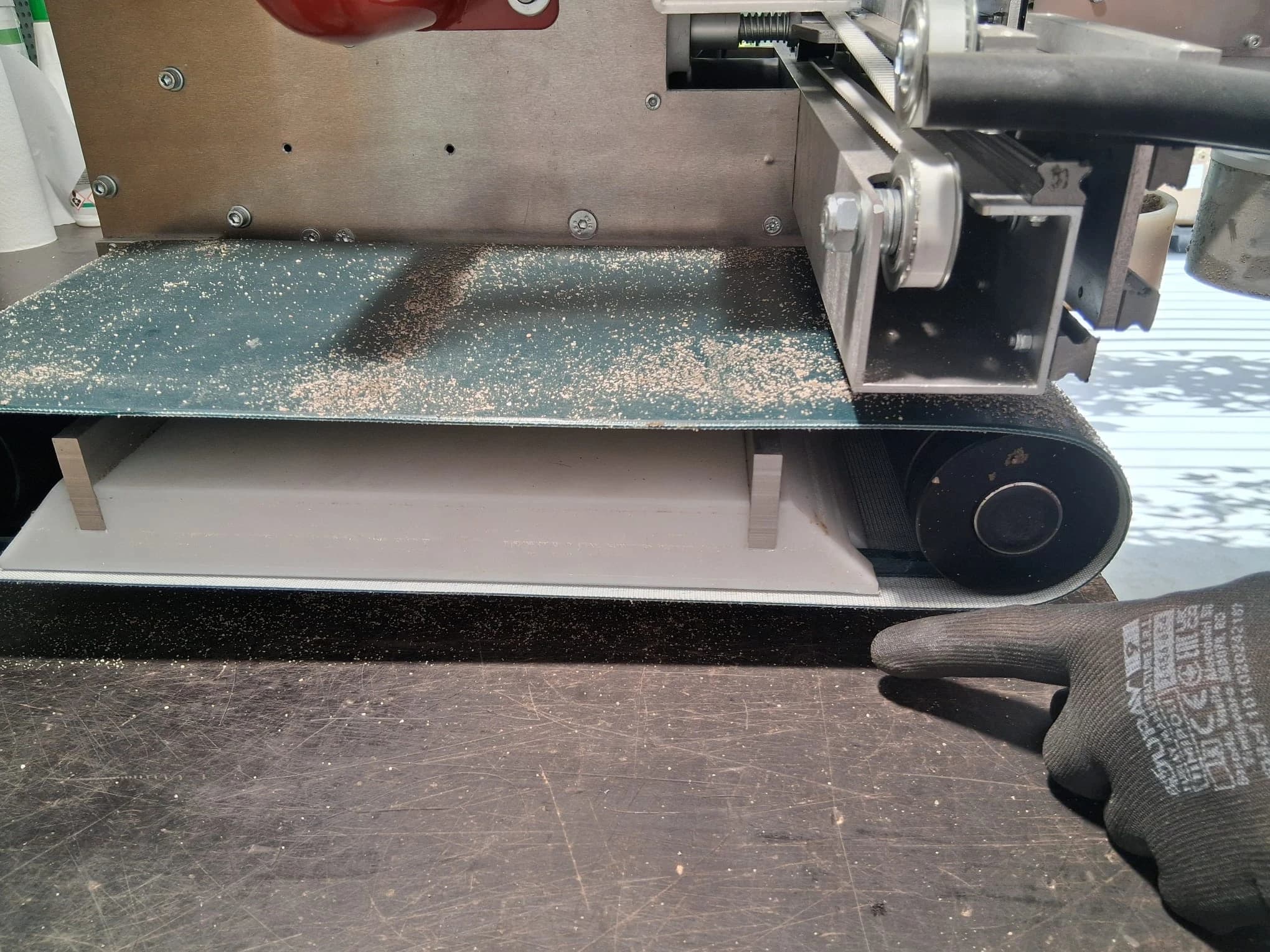 Machine lifted so the rollers are clear of the surface
